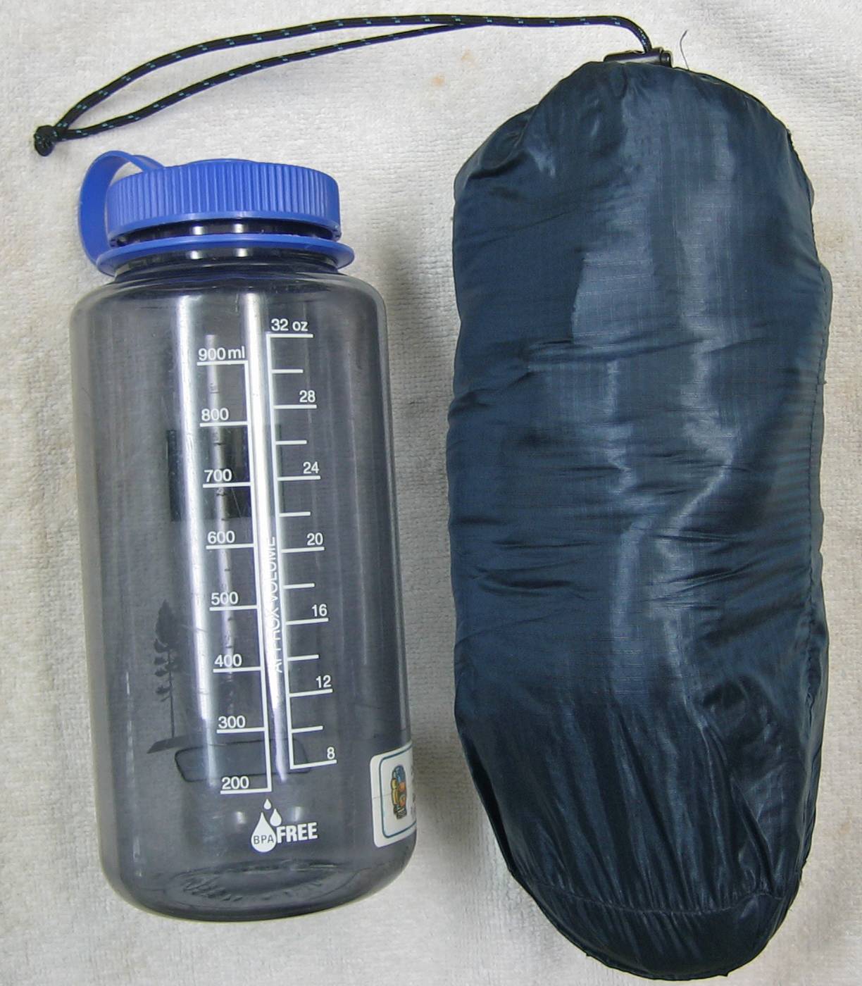 In stuff sack next to 33 oz (1 l) bottle