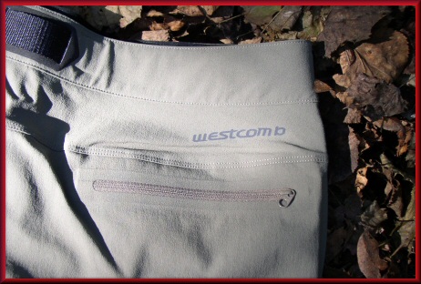 Zippered rear pocket and reflective logo