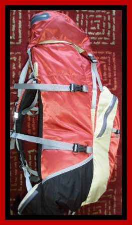 Side of pack with compression straps and stretch pockets
