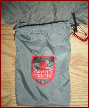 Storage sack is attached to side of hammock