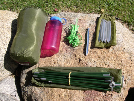 Packaged tent and rain fly. Gylines, stakes, and pole. 