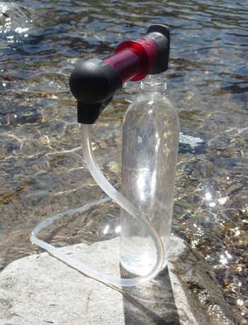 Pump attached to disposable water bottle