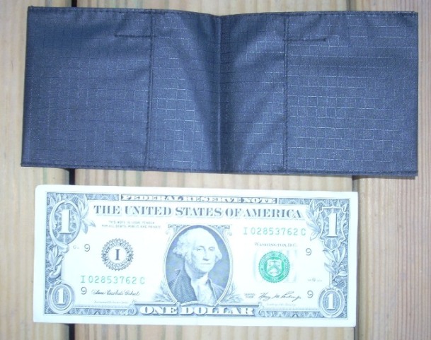 Opened wallet, compared with dollar bill size