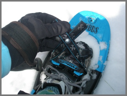 Handling the webbing on my snowshoes after snapping the ends together