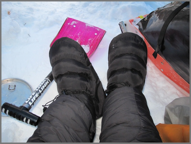 Tester relaxing at camp while wearing the Baffin Base Camp Booties