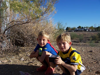 Boys finding a cache at a nearby park