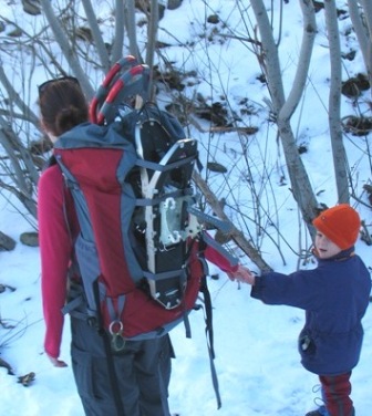 carrying 3 pairs of snowshoes