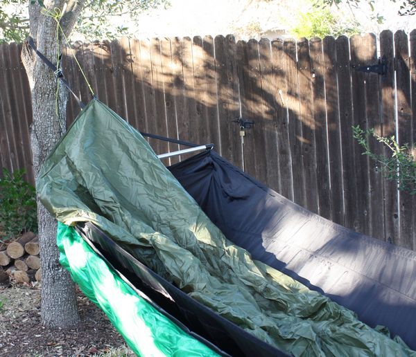 erecting the tarp over a hammock
