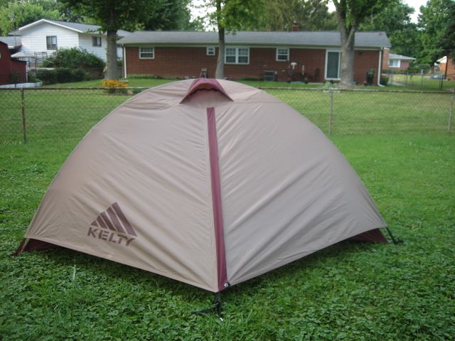Tent with the fly on from the long side showing the fly vent from a distance