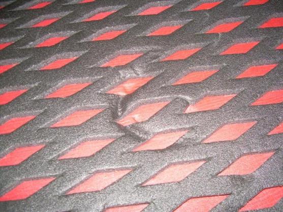 Top surface showing small dent