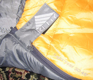 A close up of the main zipper with hook and loop tab